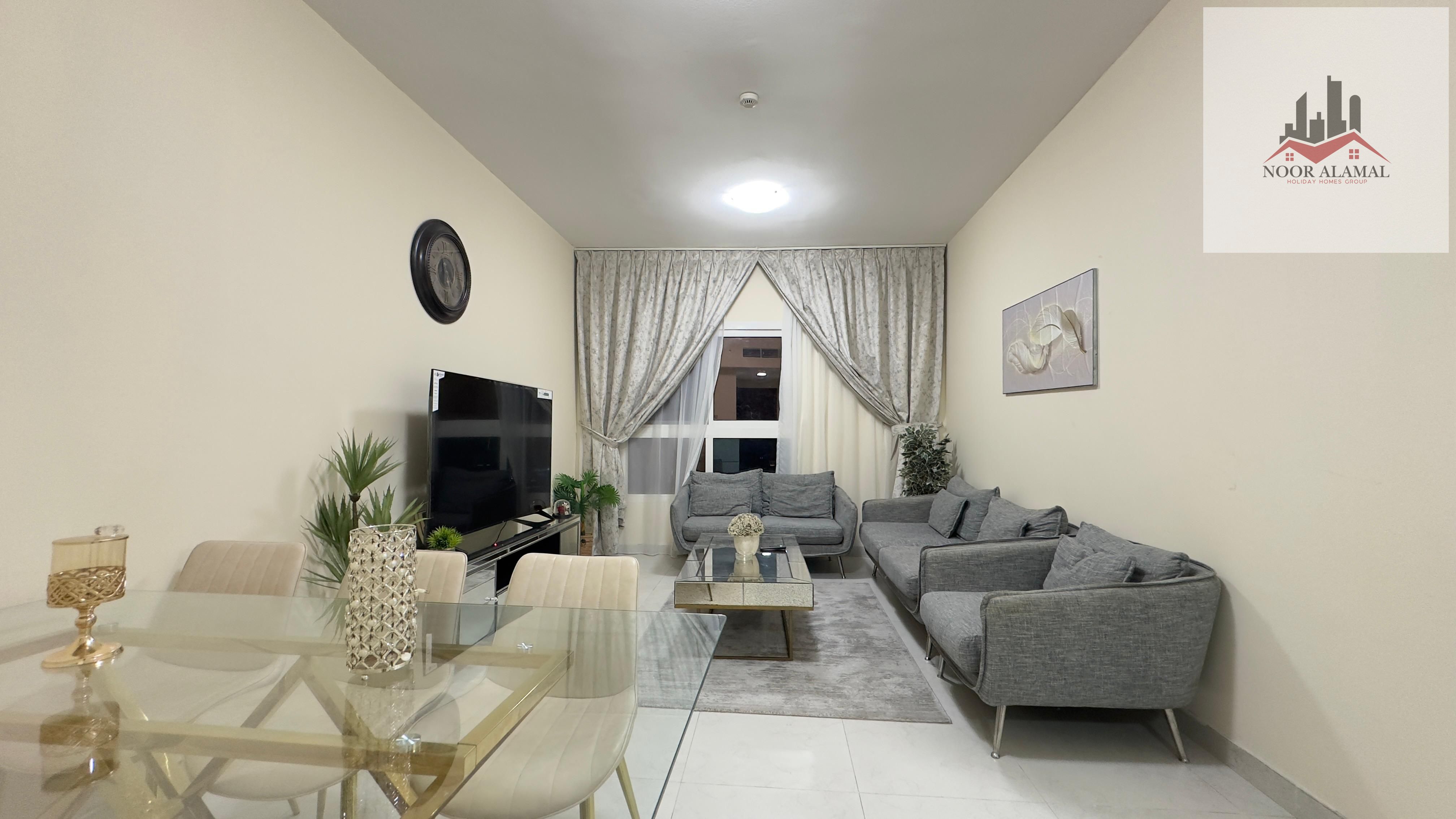 Sharjah Al Taawun, two-bedroom apartment with living room, kitchen, and two bathrooms