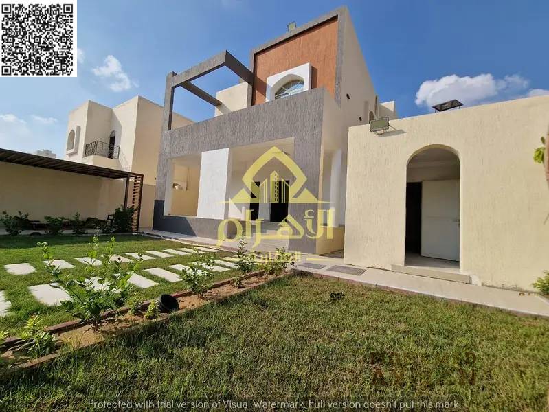 Luxury super deluxe corner villa for sale in Al Muwaihat 1, Ajman, with an annex and includes electricity, water, and air conditioning.