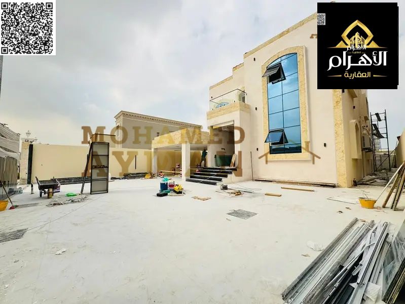 A unique opportunity to own a classic villa in Al Muwaihat 1, with a large area of 5000 sq ft, including electricity, water, and air conditioning.