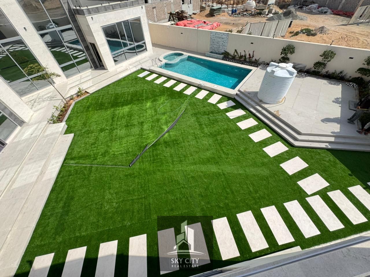 Enjoy luxury and comfort in this 10,000 sq ft villa with a large swimming pool, internal elevator, gym with jacuzzi, sauna, and steam room. Freehold