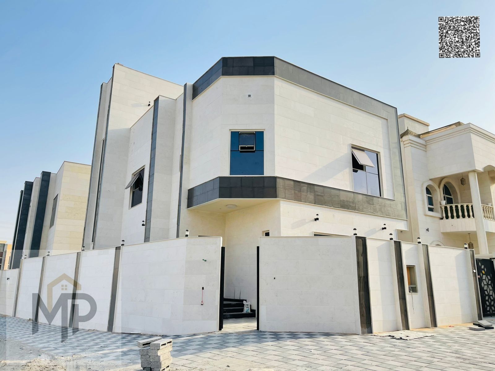 Corner villa, two floors and a roof, for sale in Al Yasmin, behind the park.