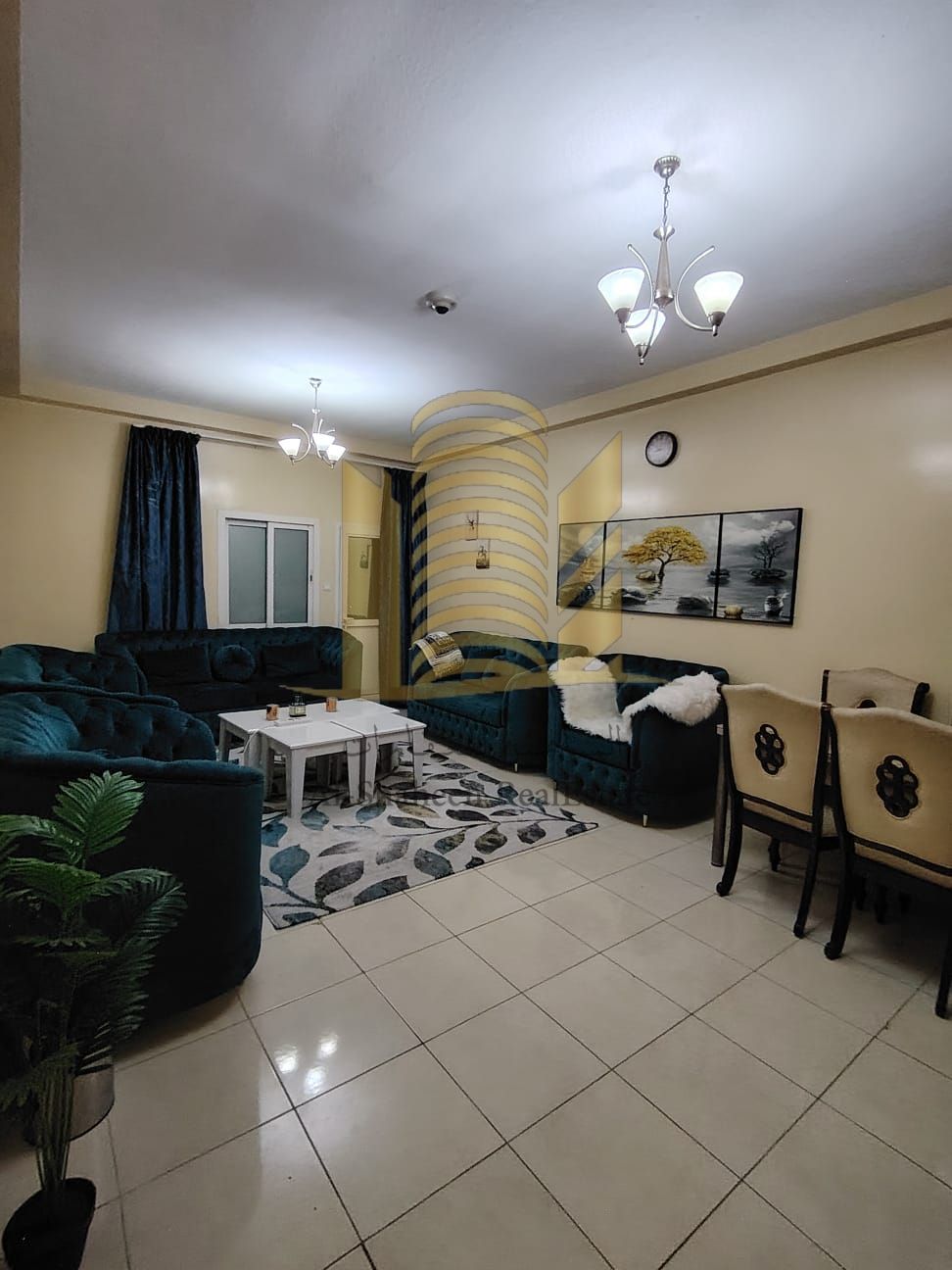 Furnished two-bedroom apartment with a living room in Orient Towers, Ajman, with a swimming pool and gym.