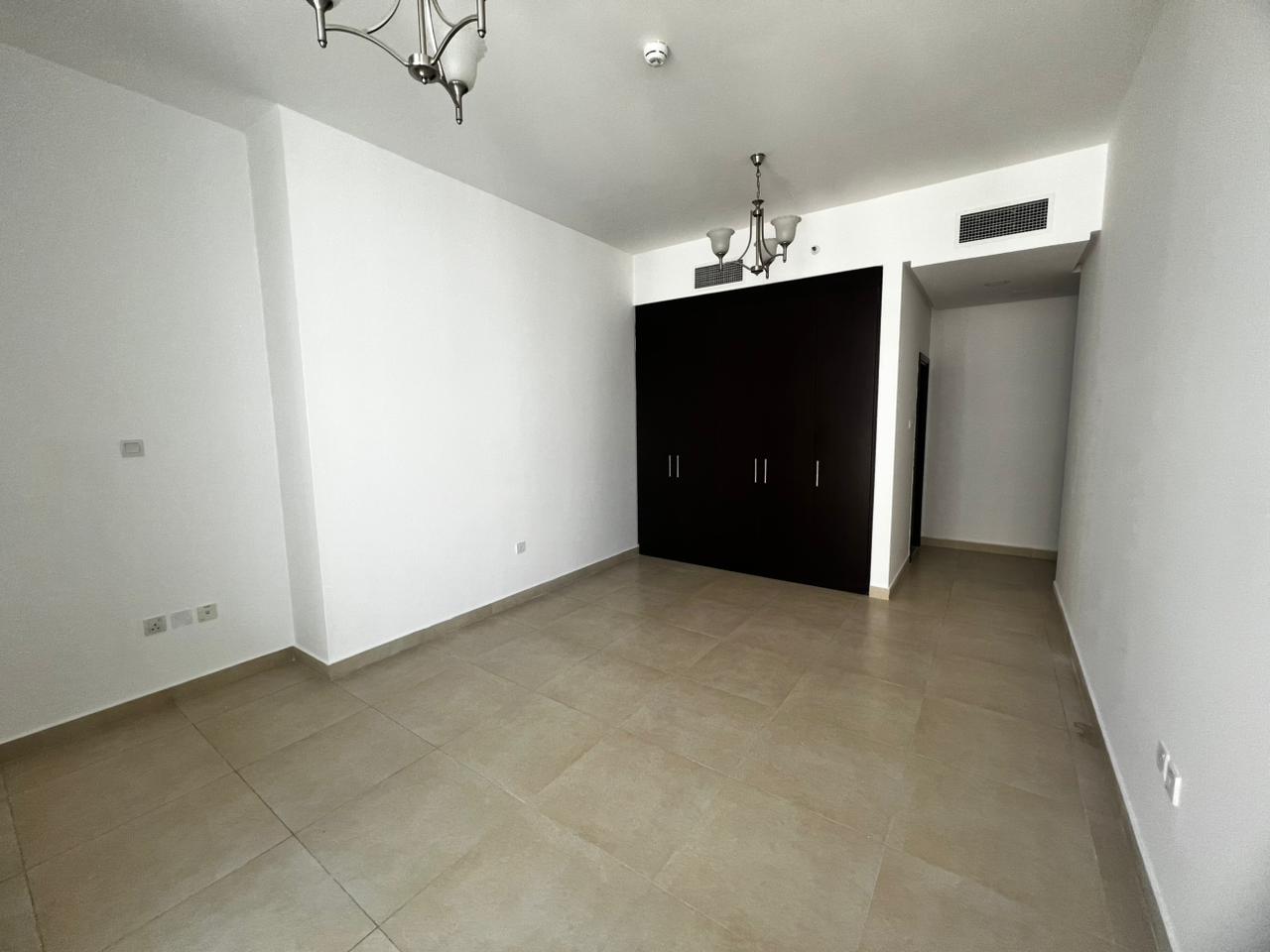 3BR + hall in Al Taawun with maid room, laundry room, built-in wardrobes, 4 bathrooms, and free parking available in a well-maintained building