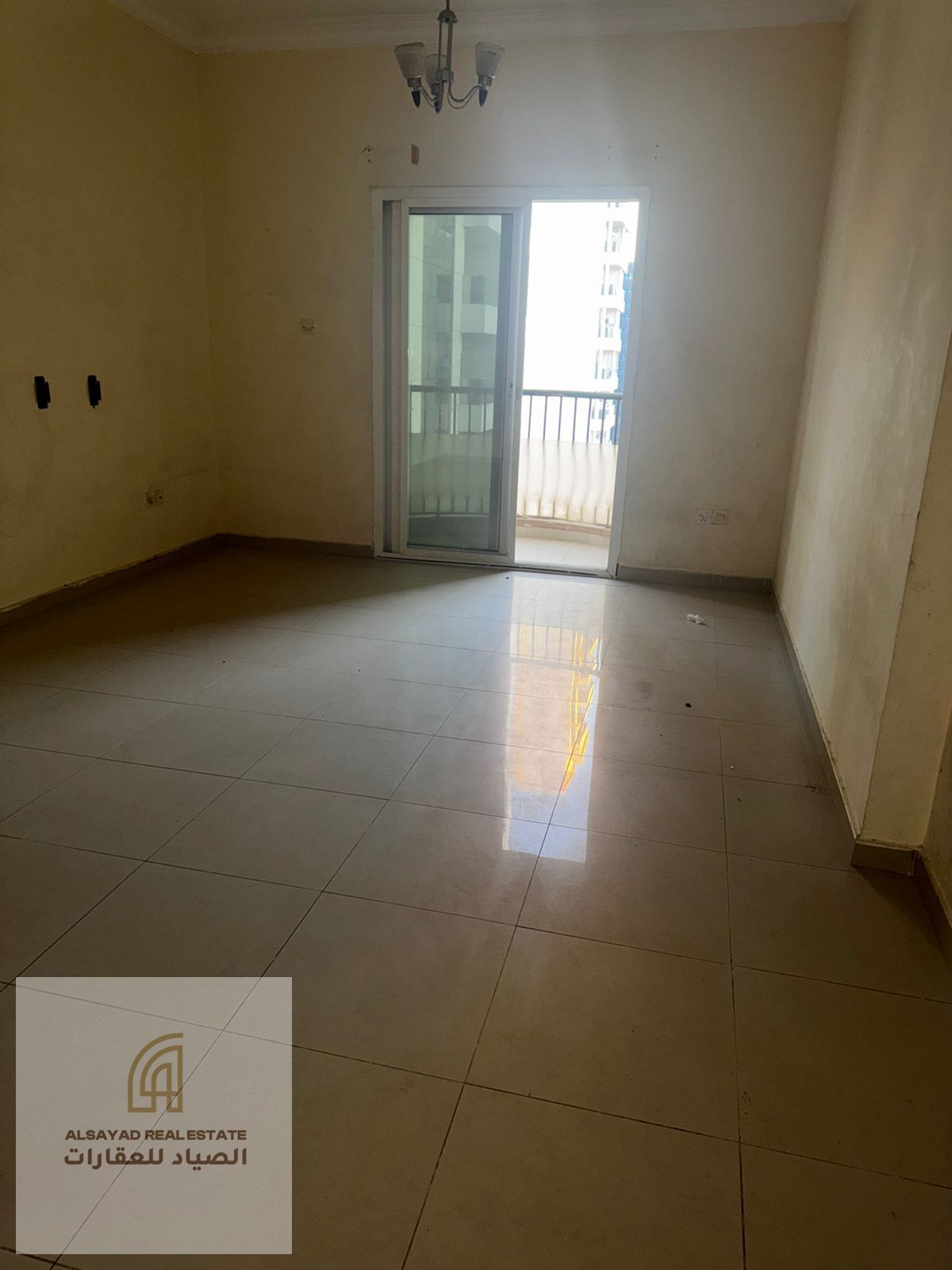 Two bedrooms and a living room for sale in Al Nahda, Sharjah, with parking, suitable for living or investment.
