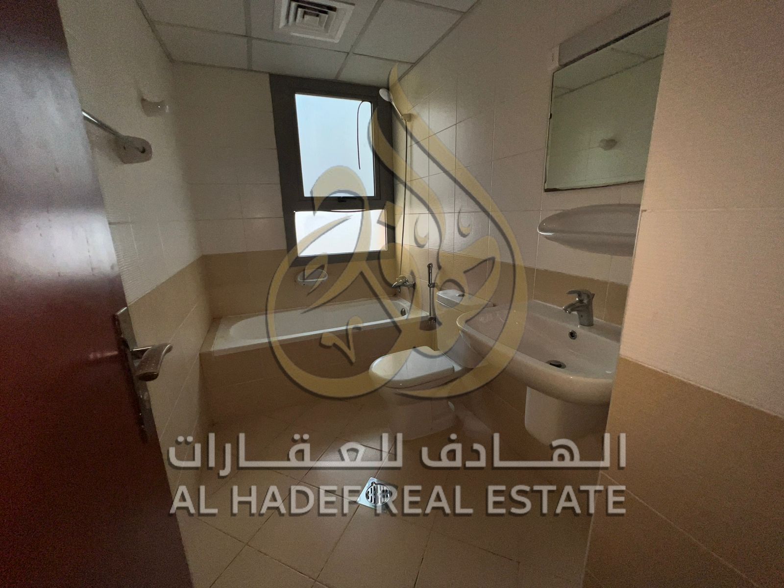 For annual rent in Al Mamzar area, Sharjah: 3-bedroom apartment with a living room and a hall, 2 balconies, 3 bathrooms, a maid's room, with one month