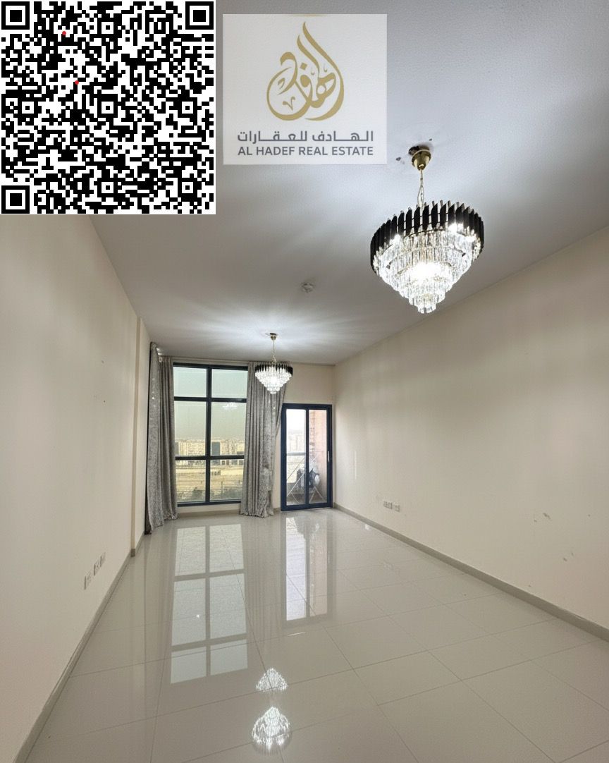 Two-bedroom apartment for sale in Al Nuaimiya Tower C. Features include: two master bedrooms, a spacious living room, a kitchen, three bathrooms, and