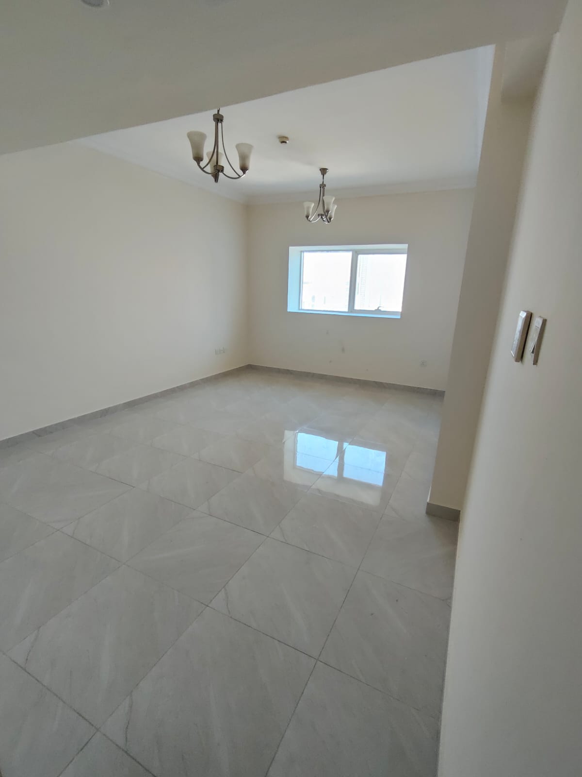 For rent: 2 bedroom apartment in a modern tower in Al Majaz 2 near Lulu Hypermarket. Central AC, free parking. Rent AED 47,000, 4 payments.