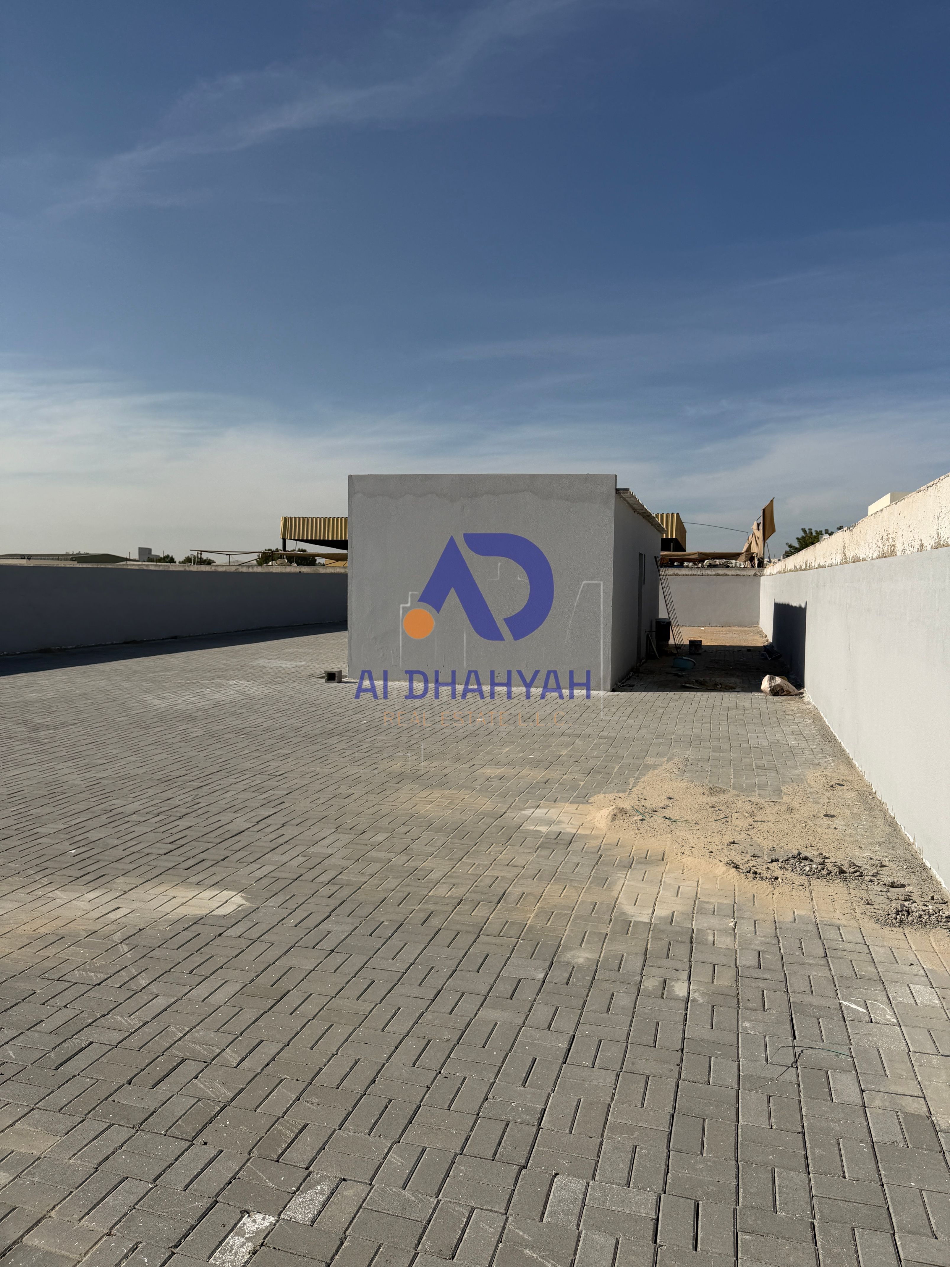Land for sale in Al Sajaa – Al Jalil. Area 5,166 sq. ft, on paved road. Electricity fees paid and ready. Great location, ideal for investment