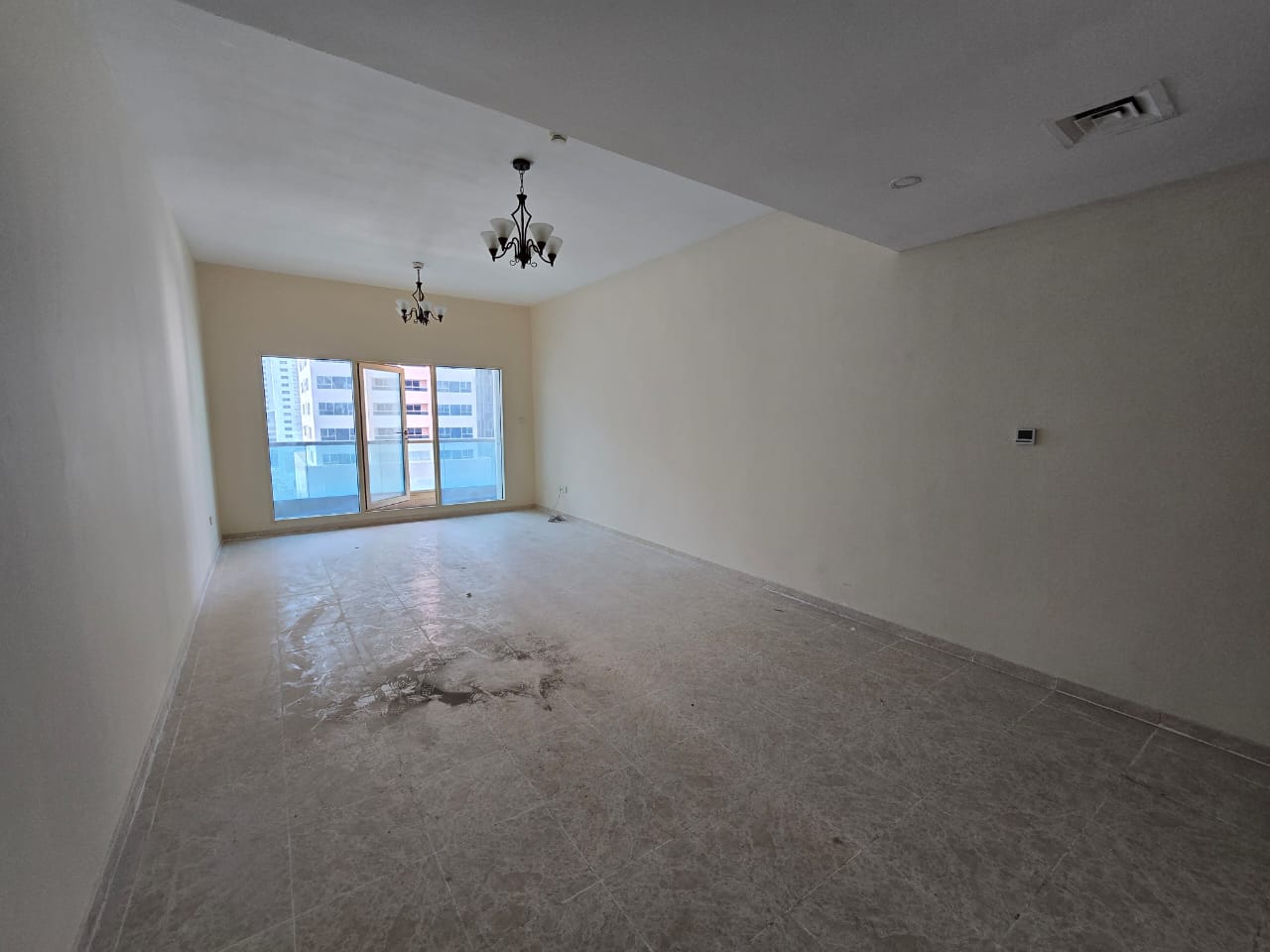 3BR apartment with balcony in Al Taawun, free AC, spacious layout, built-in wardrobes, near Dubai exit with Tabby & Tamara payment options.