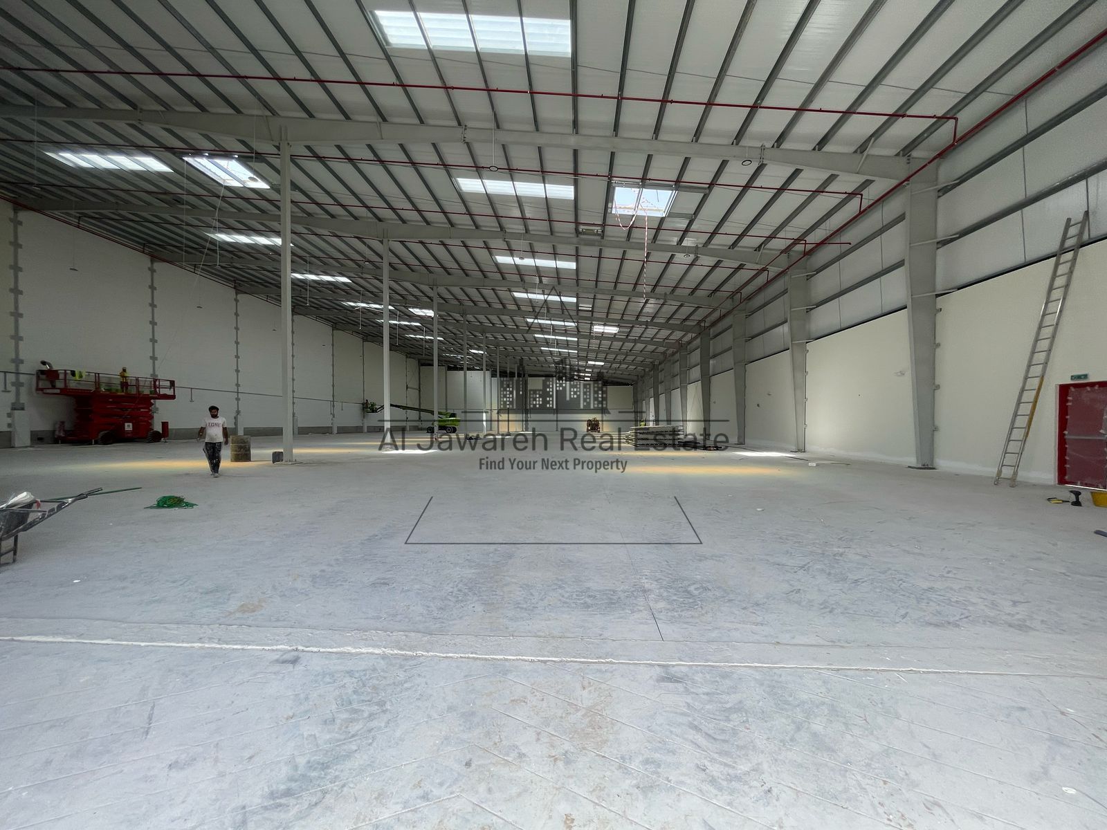 Warehouse for rent, 55,215 sq ft, on the main street. Price per sq ft: 30 dirhams.