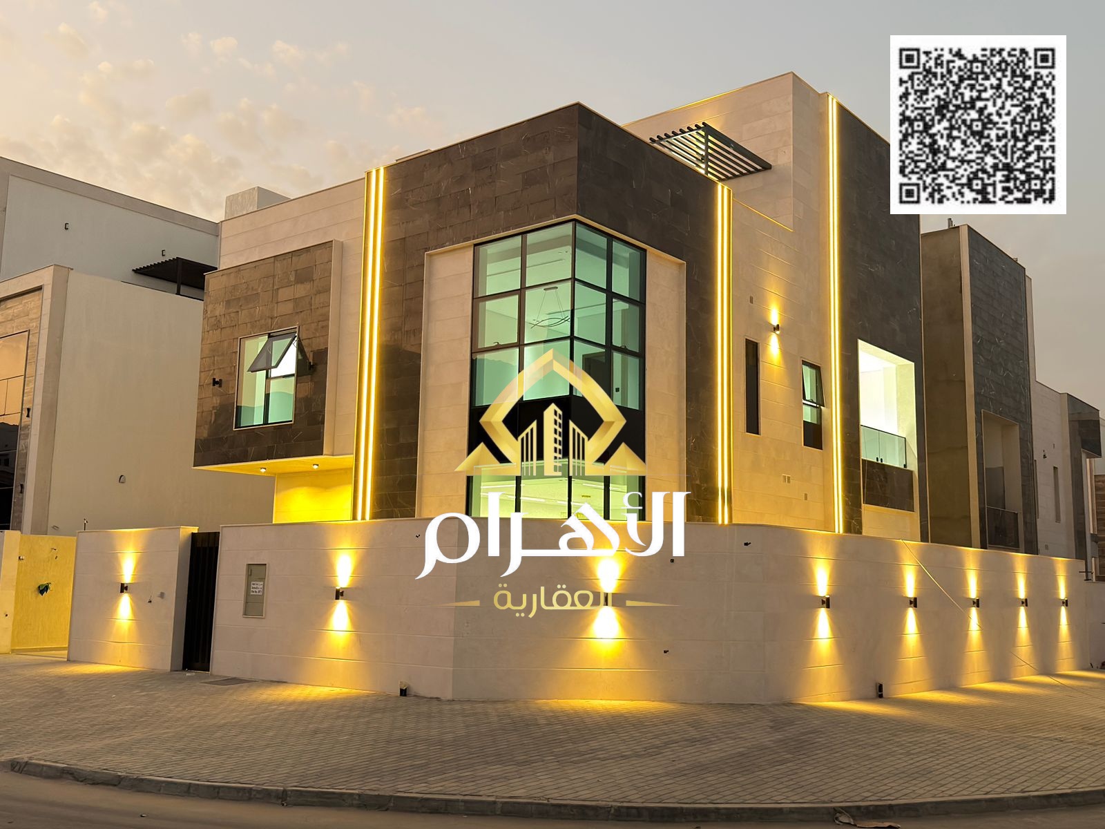 Luxury corner villa for sale in Al Helio 2, Ajman, on two streets, with a distinctive design and spacious areas.
