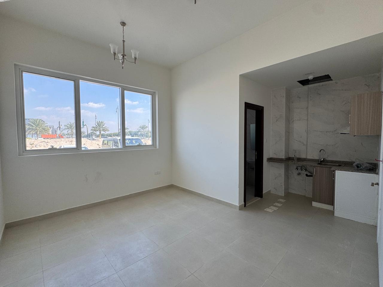 First-occupant studio for annual rent in Al Zahia, Sharjah – prime location, separate kitchen, free maintenance, and spacious area