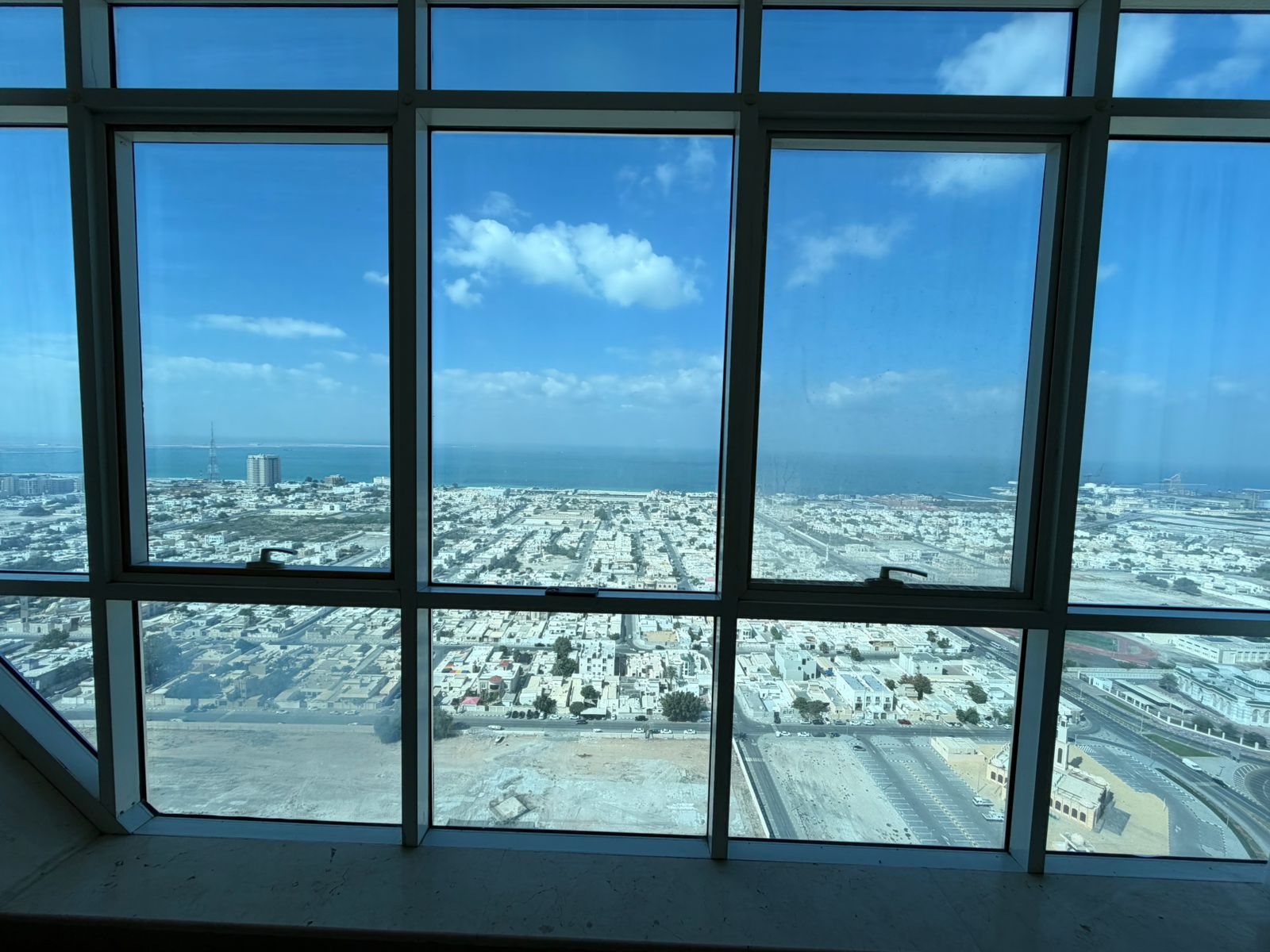 Largest three-bedroom apartment with living room, featuring a panoramic sea view, glass façades, gym, swimming pool, and free air conditioning.