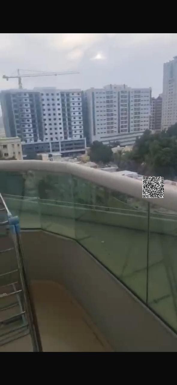 Two bedrooms and a living room with a balcony and parking