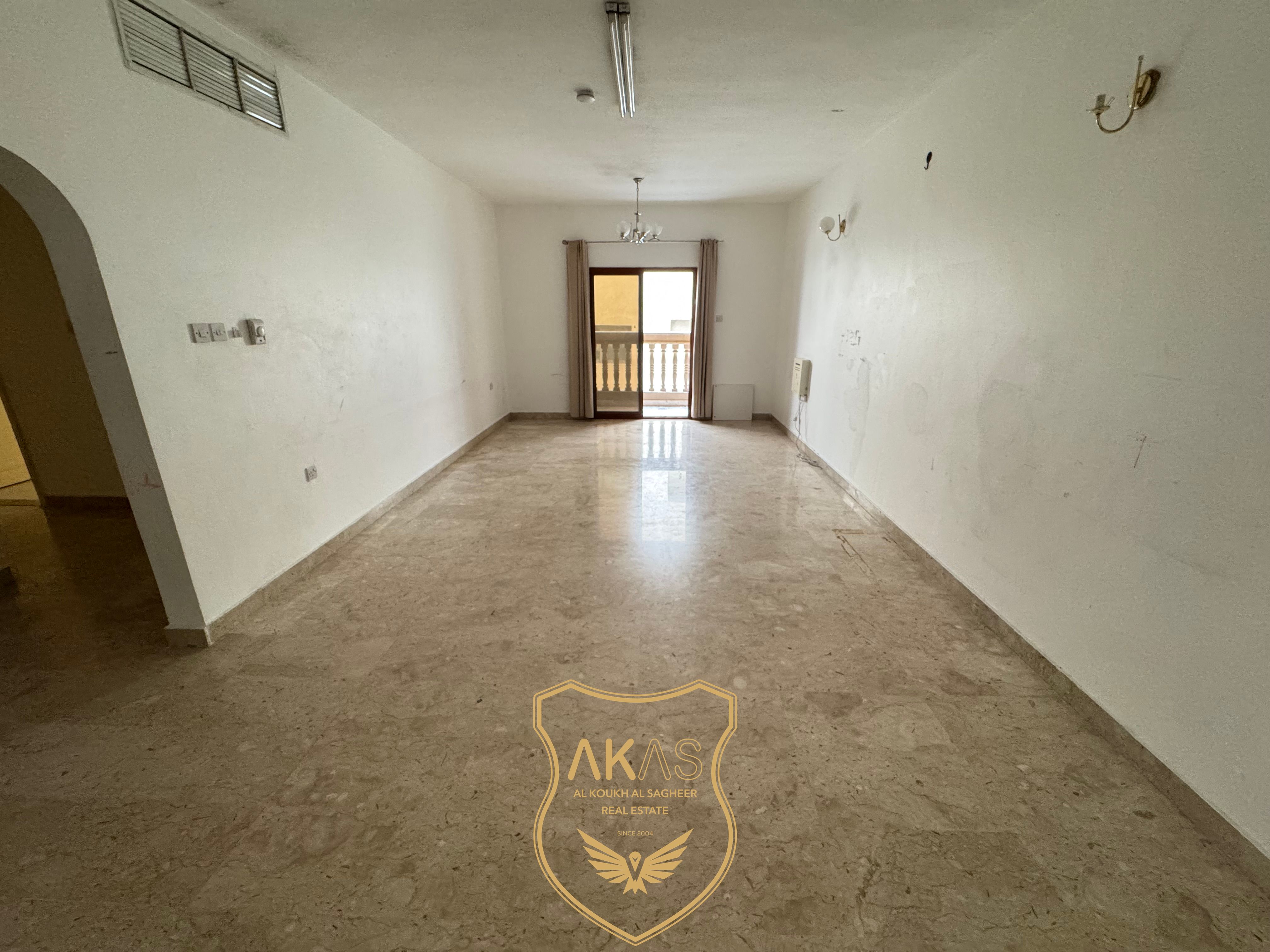 Spacious 2BHK + Maid Room | Central AC | Balcony | Free Parking | Qulayya