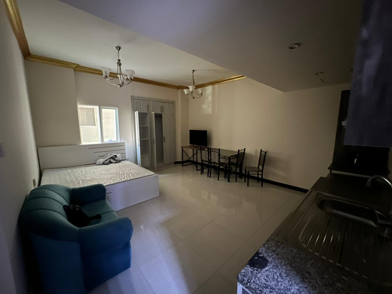 Furnished studio in Al Nahda Sharjah with open kitchen and wardrobes near Dubai exit. Flexible payments via Tabby or Tamara. Rent AED 39,000