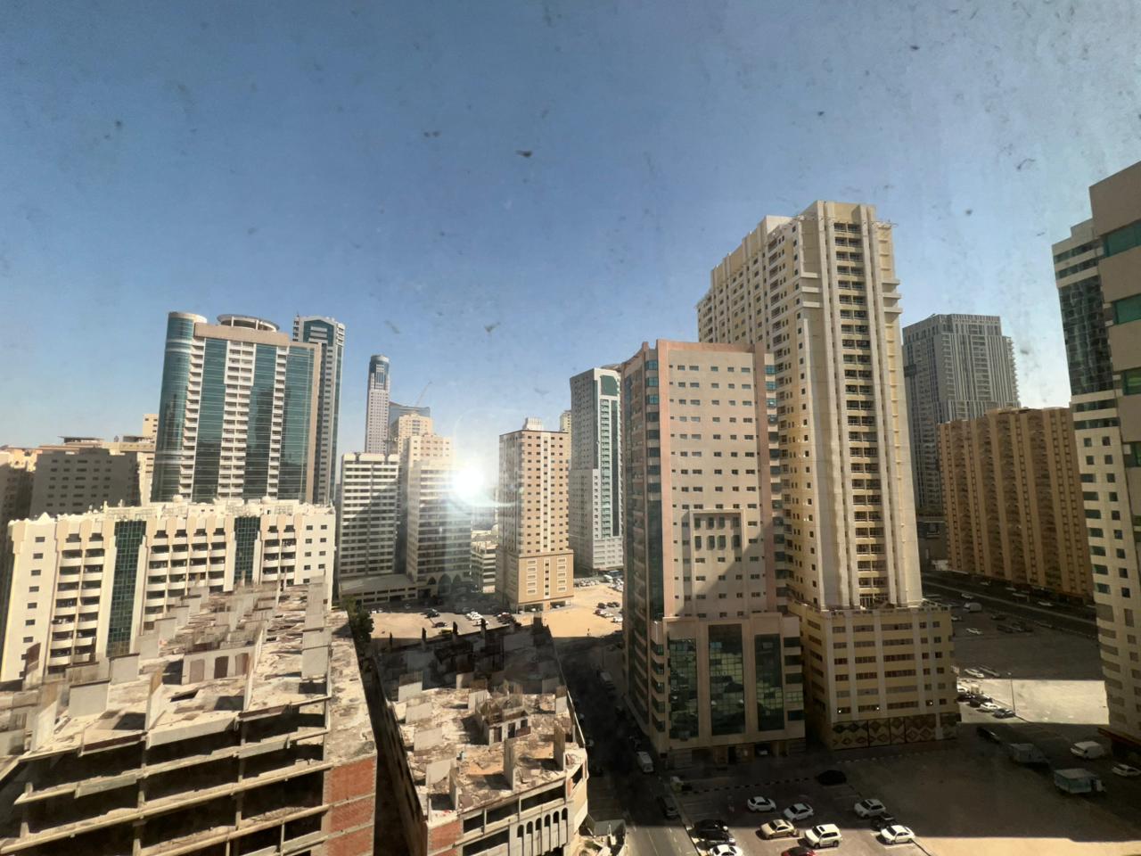 Two-bedroom apartment in Al Nahda Sharjah with open view, two bathrooms, gym and kids area, near Dubai exit, rent AED 44,000 yearly