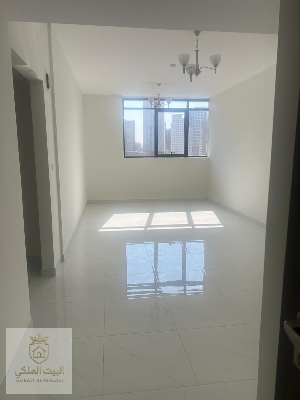 Two bedrooms and a living room with a balcony and built-in wardrobes. Beautiful open view. Brand new building, first occupancy. Free parking.