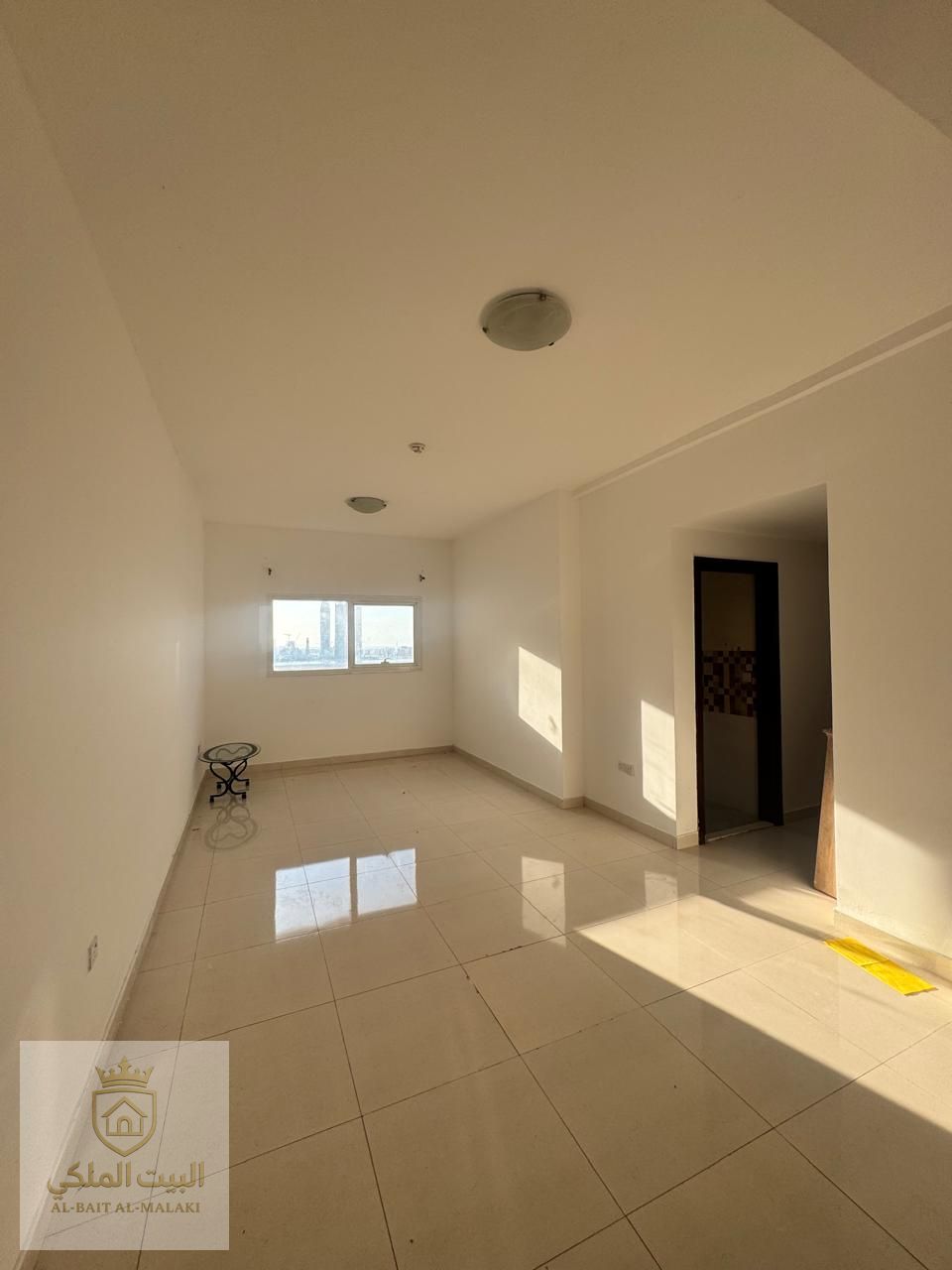 Two-bedroom apartment in Al Qasba with free parking, free month's rent, open view, and spacious living area.