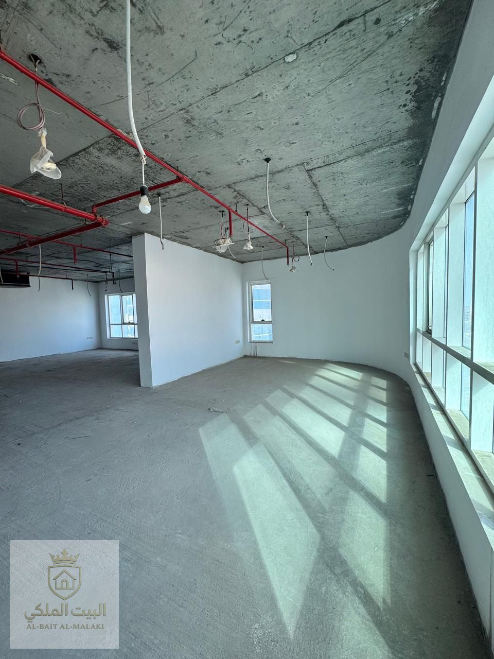 Office for sale in Al Majaz 2, spacious, with air conditioning (owner's included) and three parking spaces.
