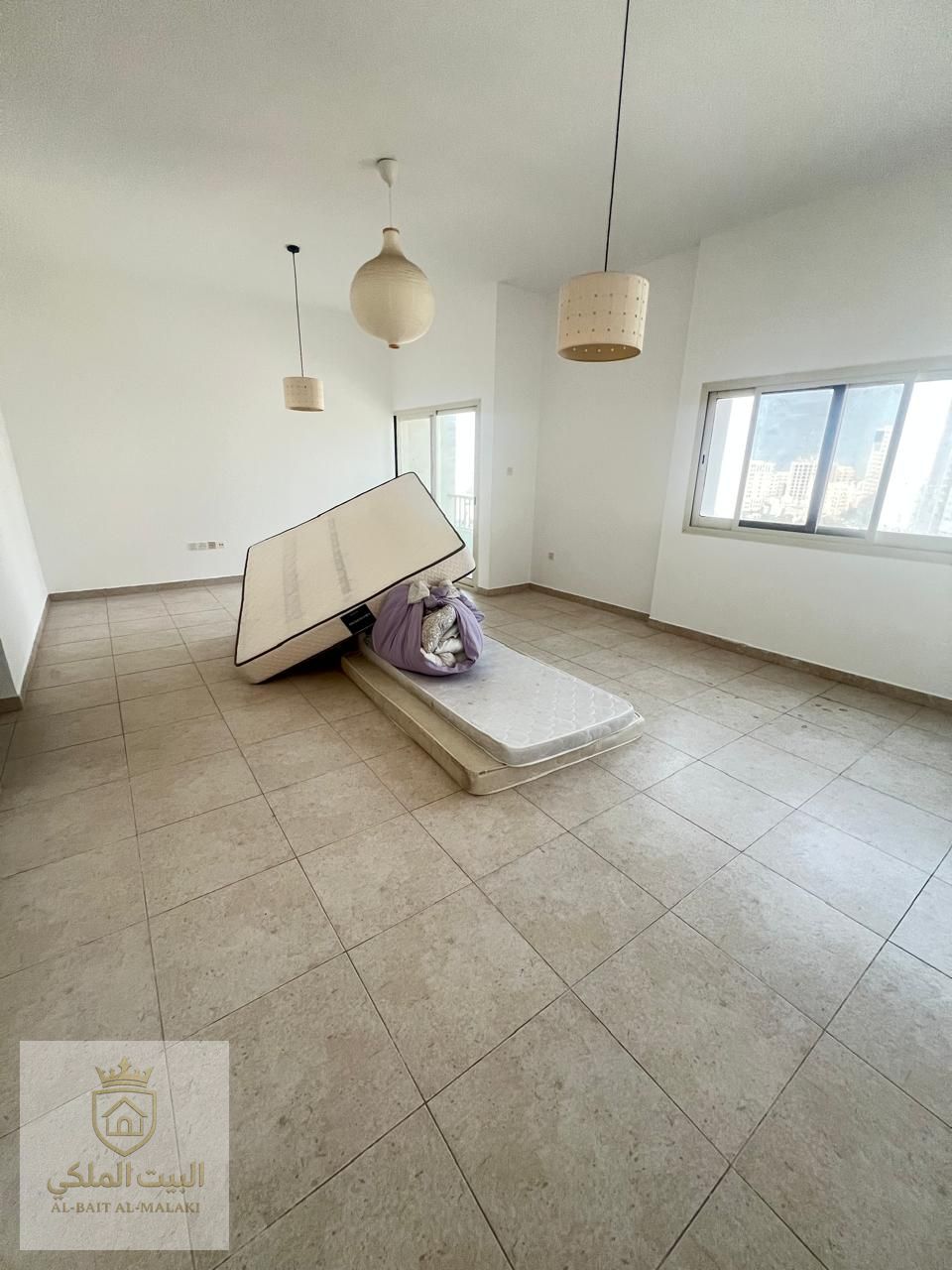 Luxurious apartment in Al Majaz 3 featuring three bedrooms and a spacious living room with a balcony and open, beautiful views. Includes four master bathrooms with built-in wardrobes, a maid’s master room with closets