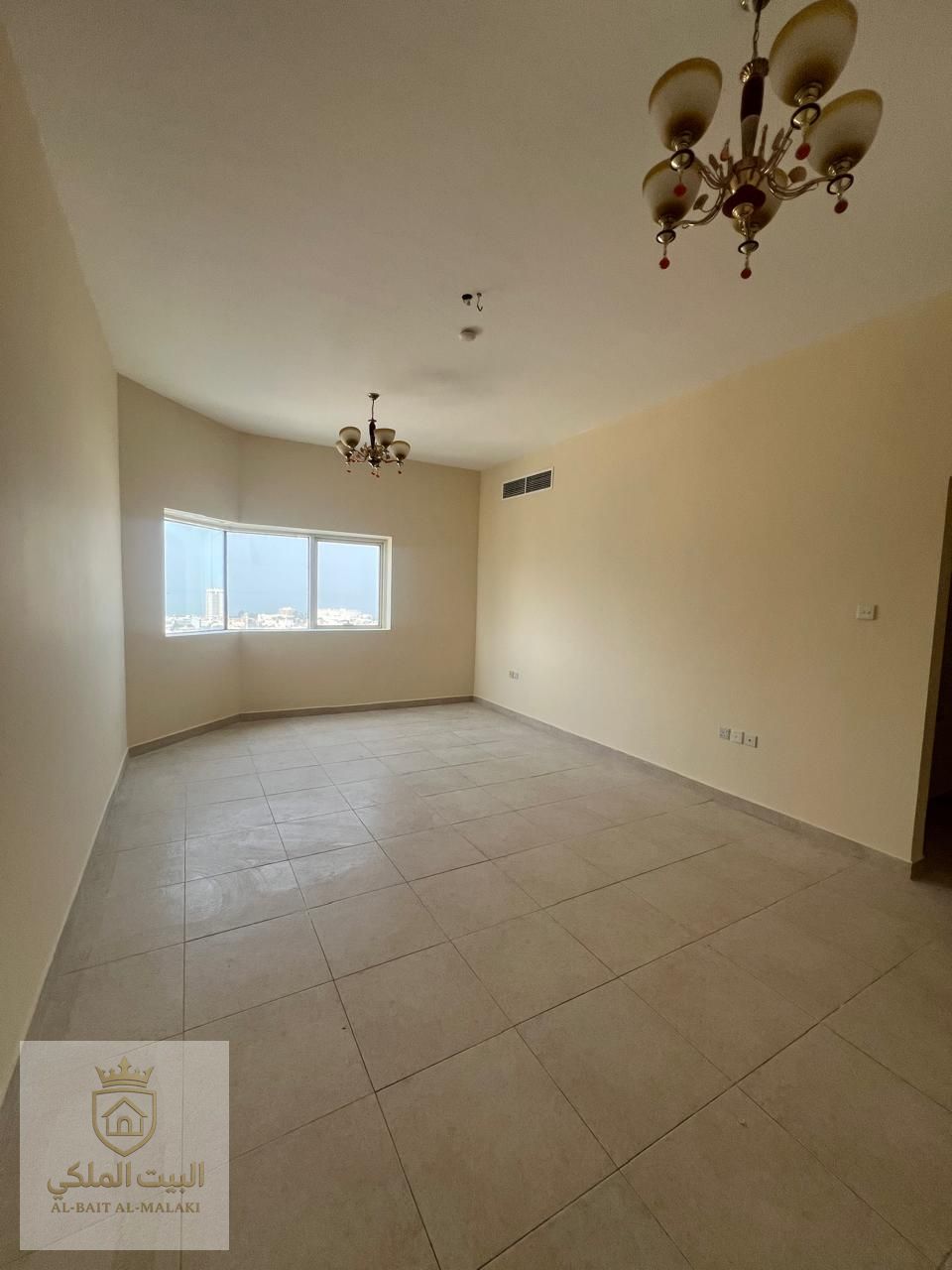 Spacious and elegant apartment for rent in Al Majaz 3, featuring two bedrooms, a bright living room, and a balcony with a beautiful open view