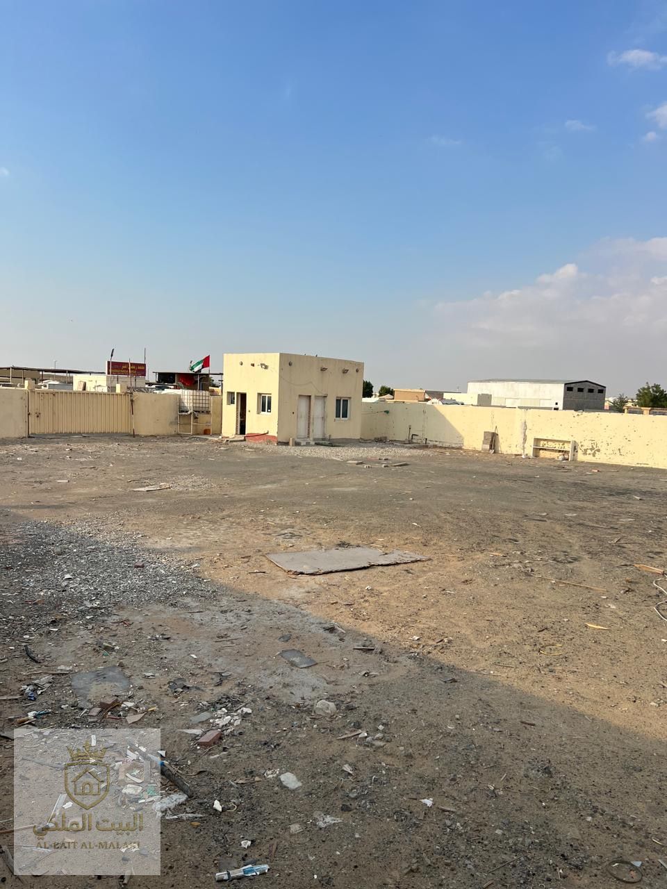 Walled land in Al-Saja industrial area with a large area and payment facilities