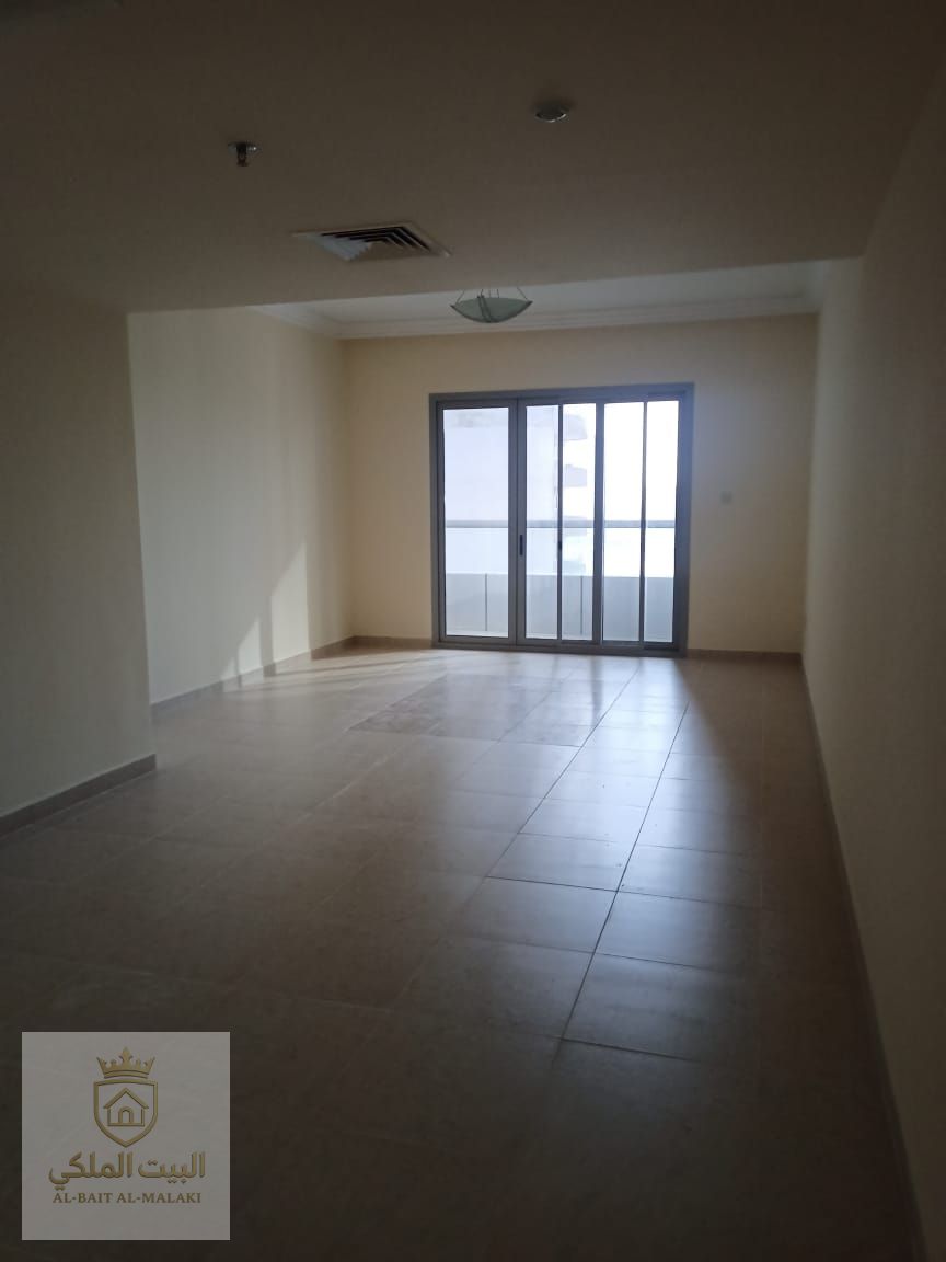 Spacious apartment for rent in Al Taawun, featuring three bedrooms, a living room, and a small maid’s room. The unit offers a wide layout with a full and direct sea view, providing a relaxing and luxurious living experience.