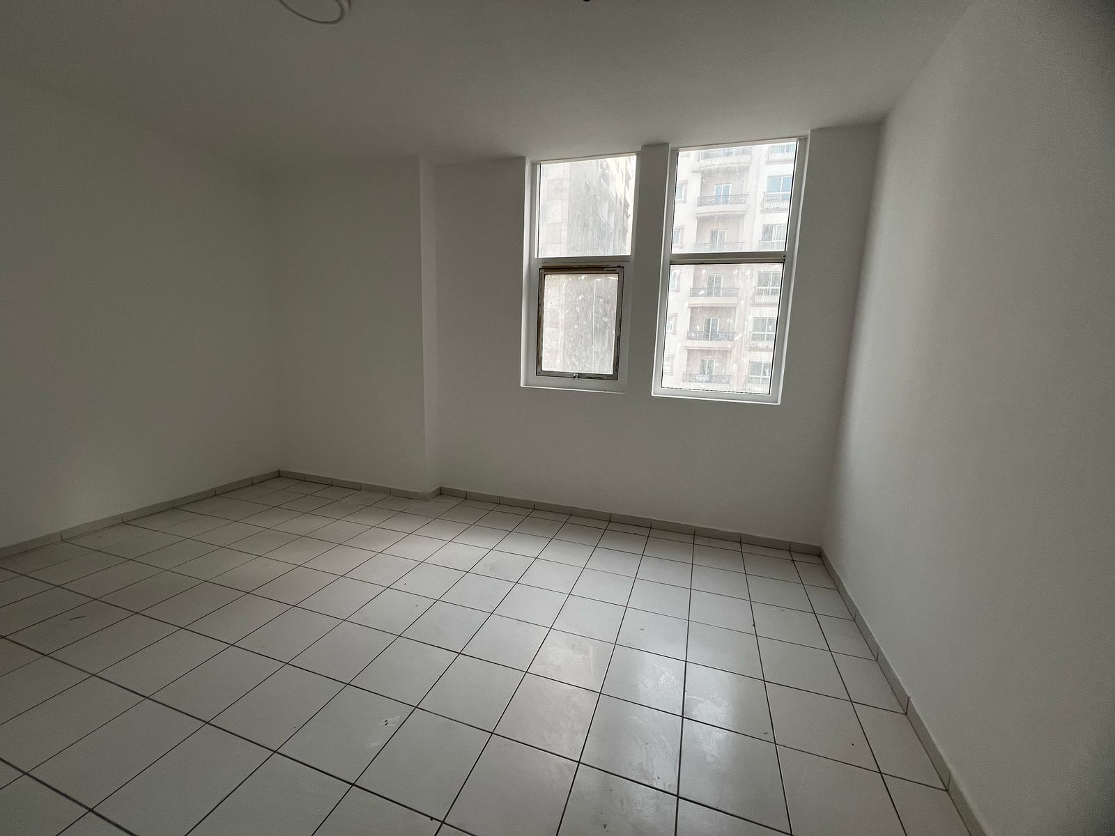 One-bedroom apartment with living room in Al Taawun, balcony, free parking, rent in 6 payments, AED 2,000 deposit, no fees