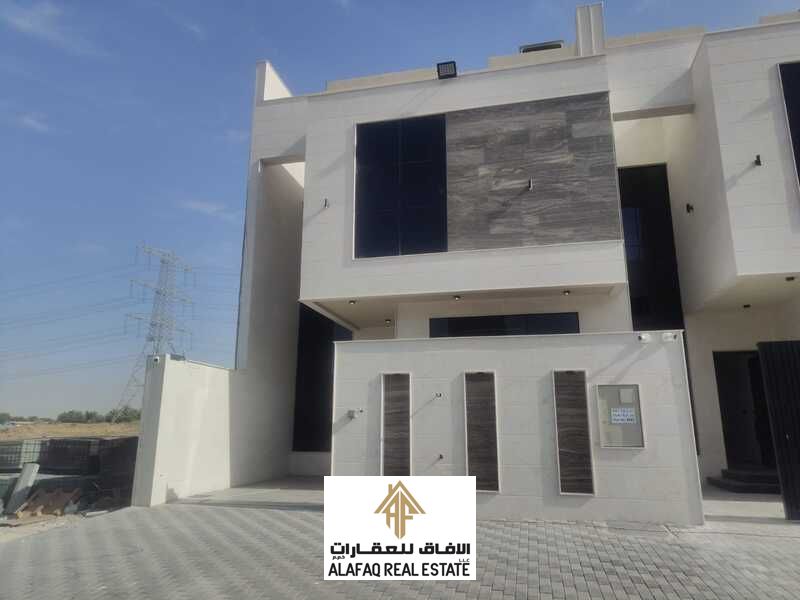 Townhouse for sale with an elegant stone facade reflecting a sophisticated architectural style