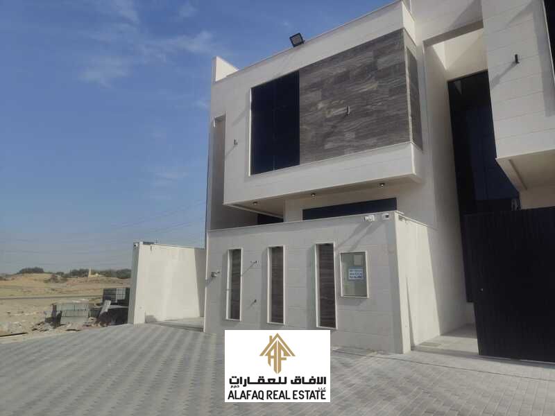 Luxury townhouse villa for sale in Al Helio 2, Ajman, featuring high-end finishes, 5 master bedrooms, majlis and living hall, roof and outdoor seating