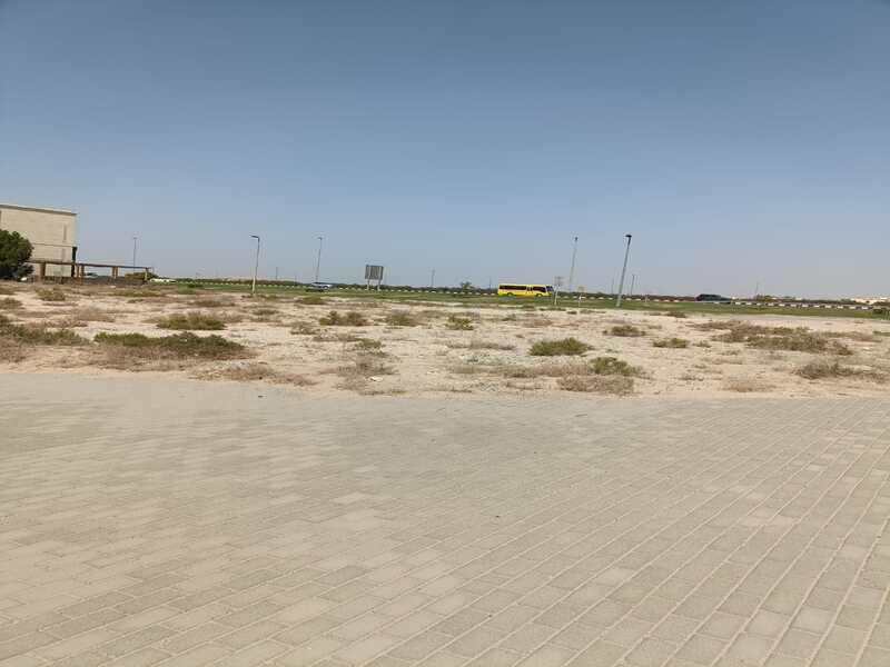 Land for sale in Industrial Area 18, measuring 26,700 square feet, prime location on the main road.