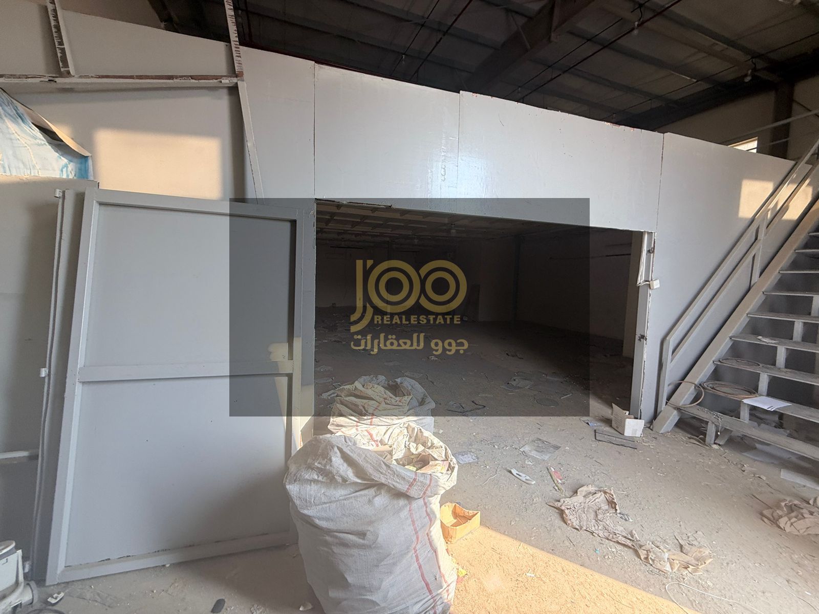 A mezzanine warehouse for rent in Umm Al Thu'ub offers ample space that can be utilized for various activities and equipment organization.