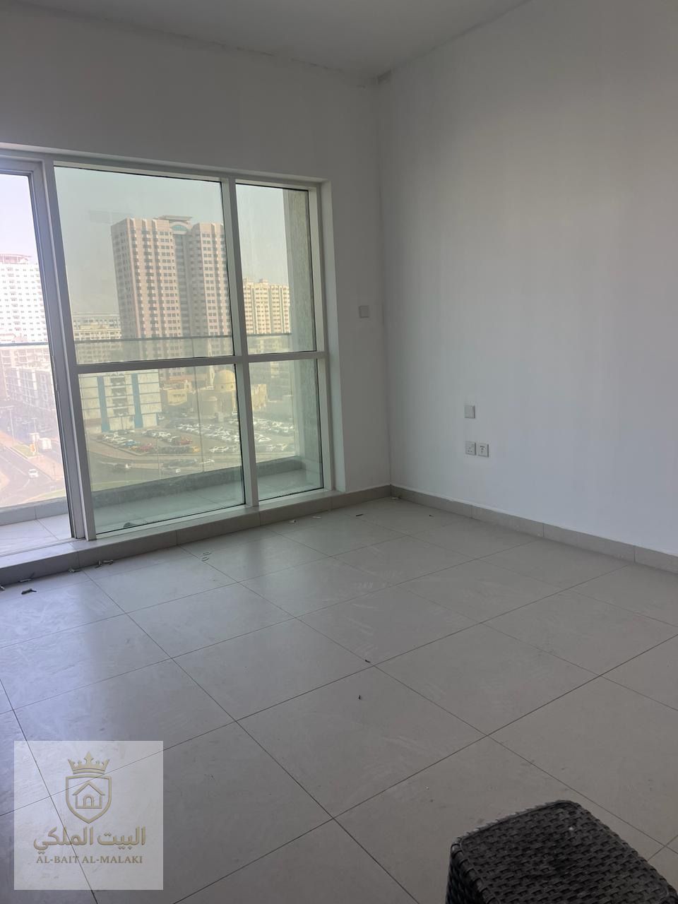 Super deluxe two-bedroom apartment with living room and balcony for annual rent, located in Al Taawun area with direct access to Dubai exit. The apartment is in a second-tenant building, offering excellent condition and high-quality finishing