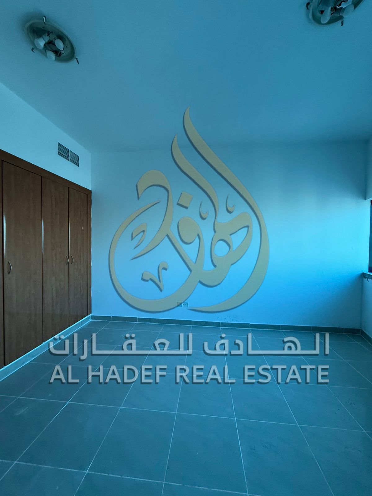 Apartment for rent in Al Mamzar Al Taawun, 2 bedrooms and hall with maid’s room and wardrobes, direct Dubai exit, separate gyms and pools, tennis cour