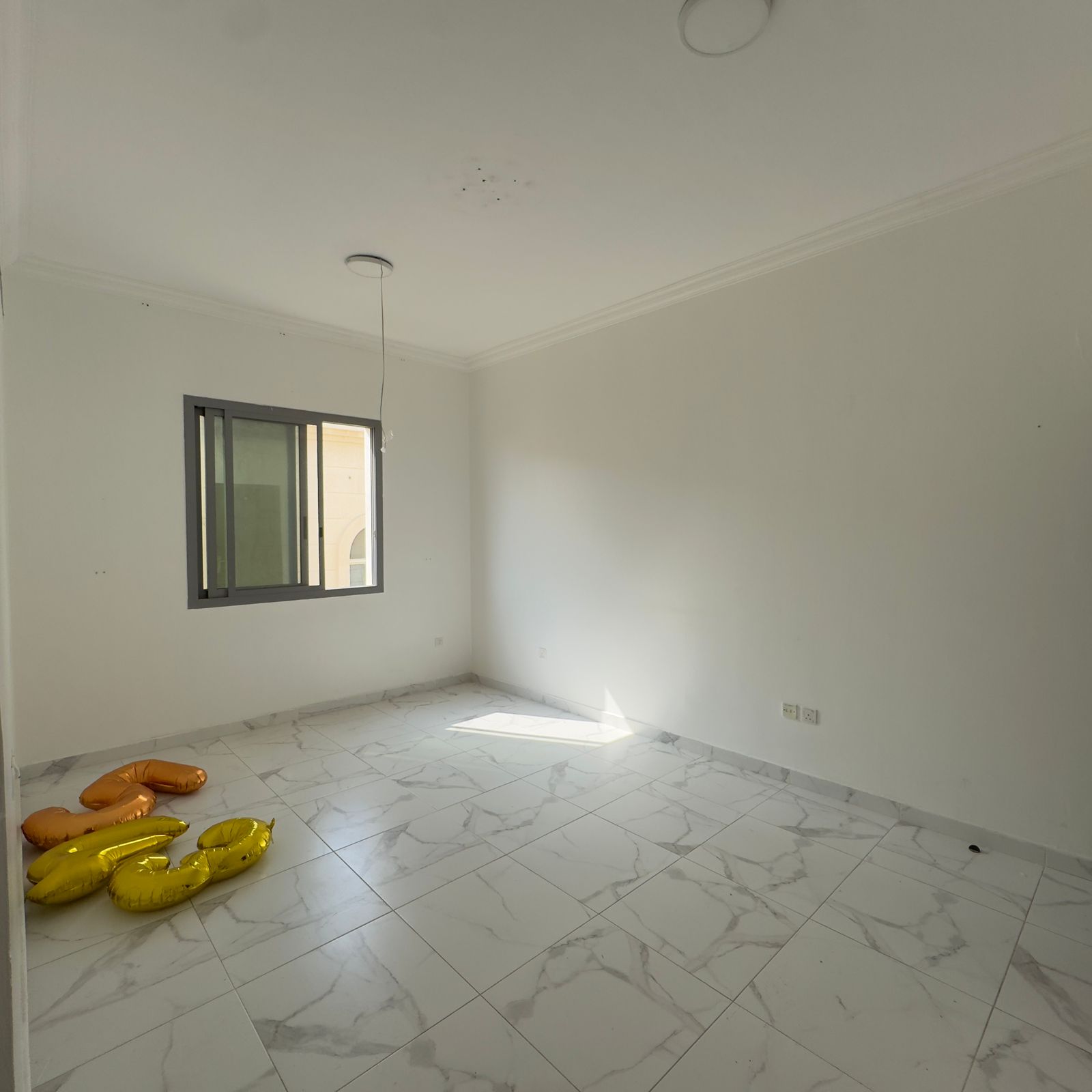One bedroom and living room in Al Rawda, near Al Hamidiya Police Station. 2 bathrooms. Central air conditioning.