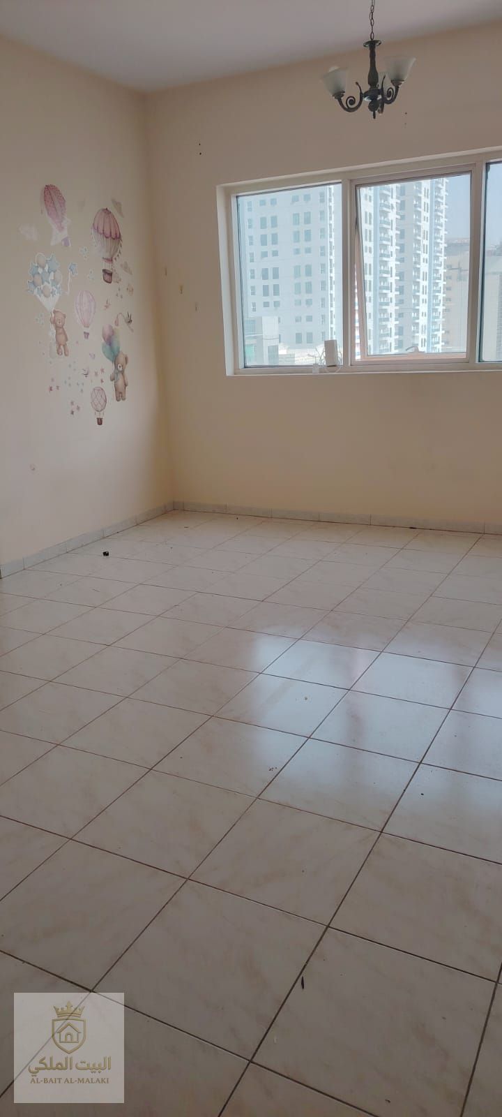 One-bedroom apartment with living room for rent in Al Taawun area, offering a spacious layout and practical design that ensures comfortable living.