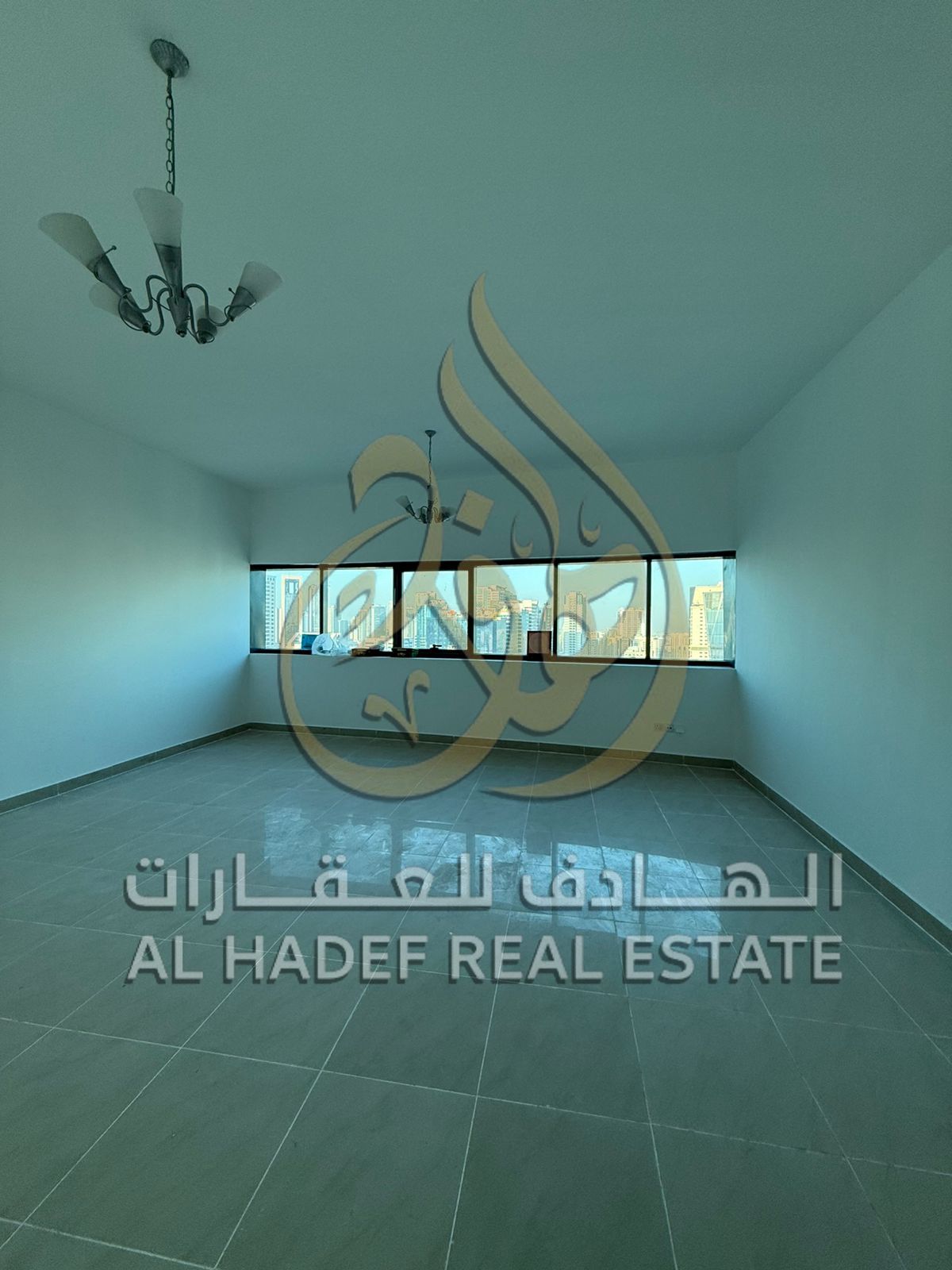 For rent in Al Taawun - Two bedrooms and a living room + maid's room + built-in wardrobes + 2 gyms (one for men and one for women) + 2 swimming pools