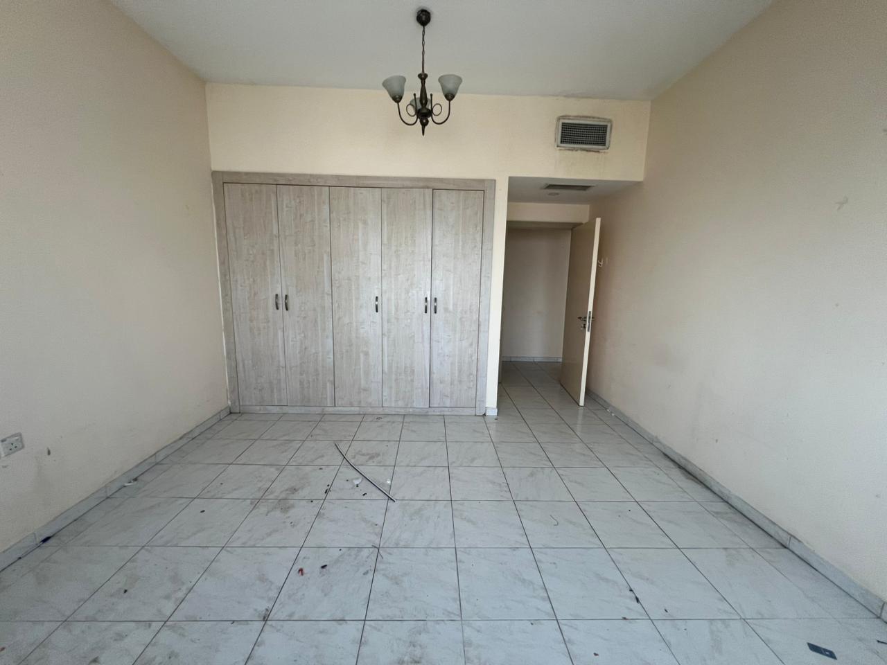 One bedroom and living room with built-in wardrobes