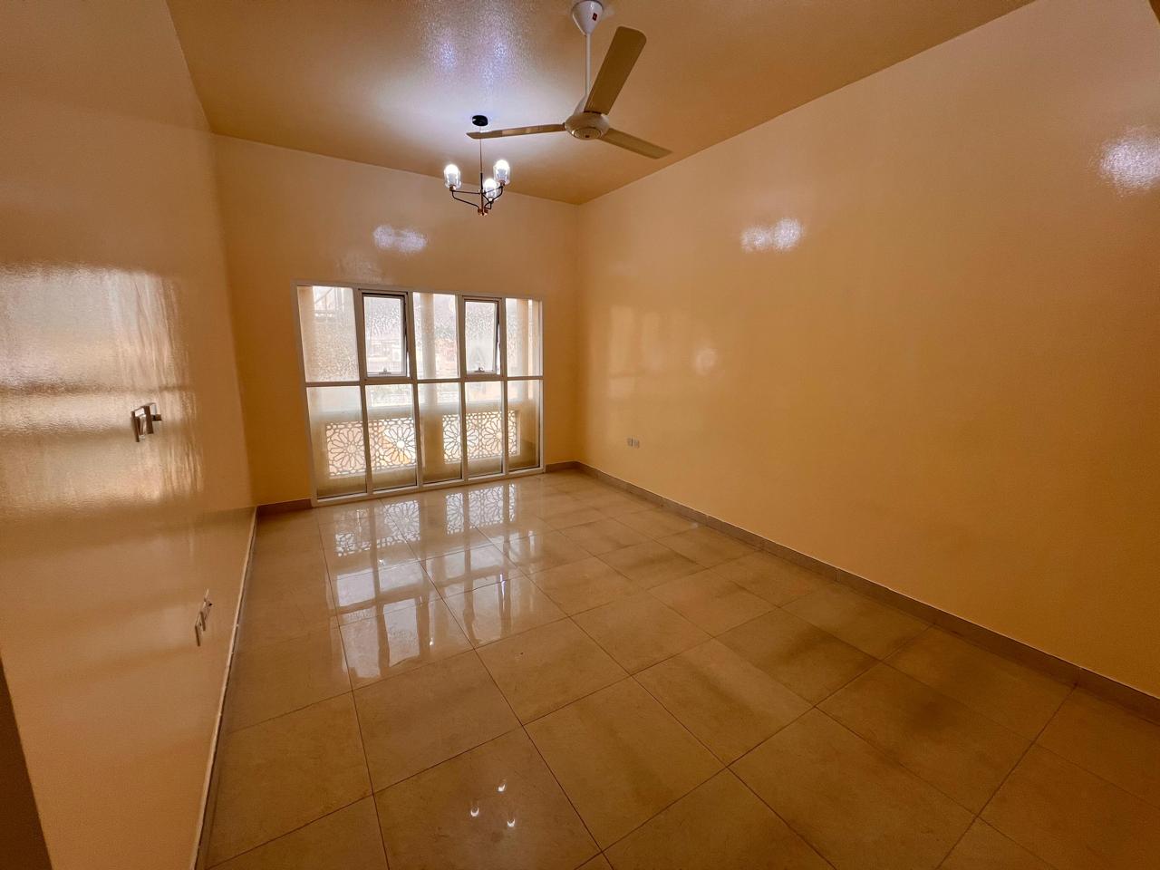 A bedroom and a living room, two bathrooms, a separate hall, central air conditioning, spacious areas, and a prime location close to schools and near