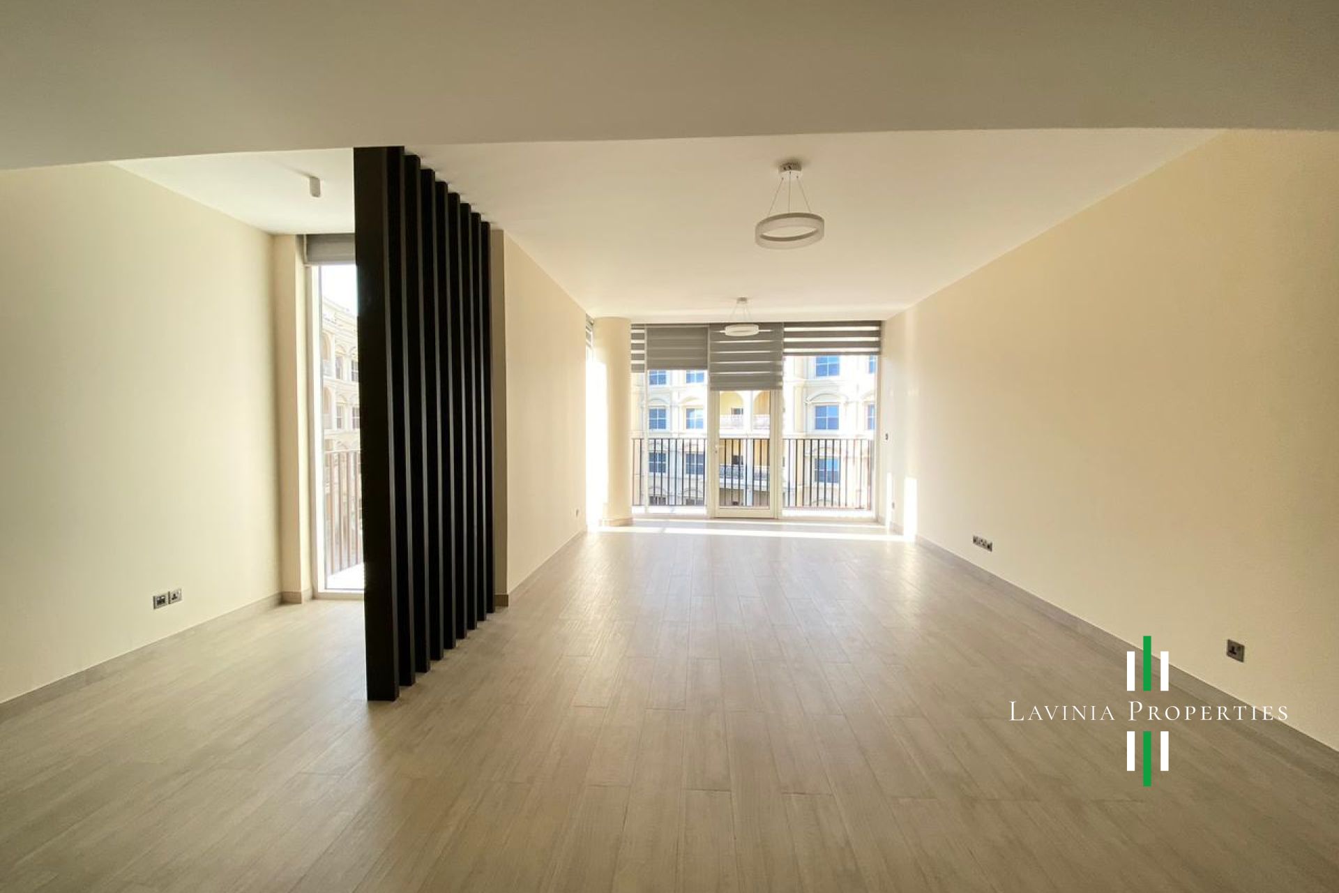 SPACIOUS LIVING ROOM | POOL VIEW | VACANT