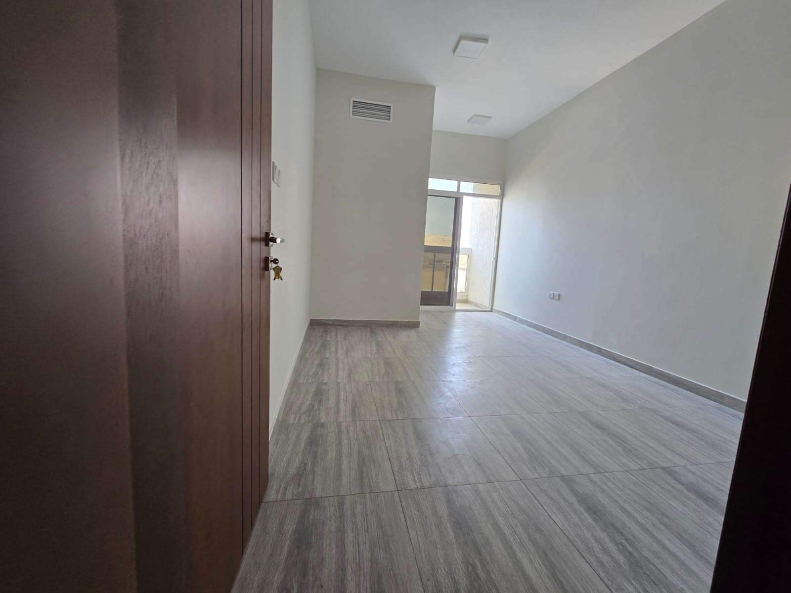 One bedroom and a living room _ Second occupant _ Al Jurf 3, Ajman _ 2 balconies - Master bedroom _ Central air conditioning