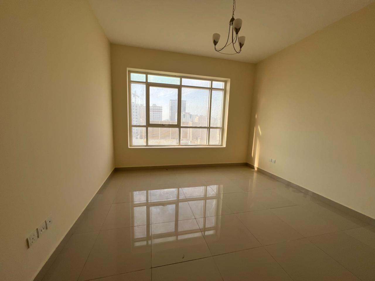 Two bedrooms and a living room in Abu Shagara with free maintenance wardrobes