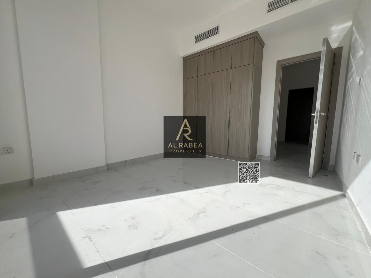 One-bedroom apartment with a living room for annual rent, first tenant in Al-Aliya, featuring a balcony, two bathrooms, and