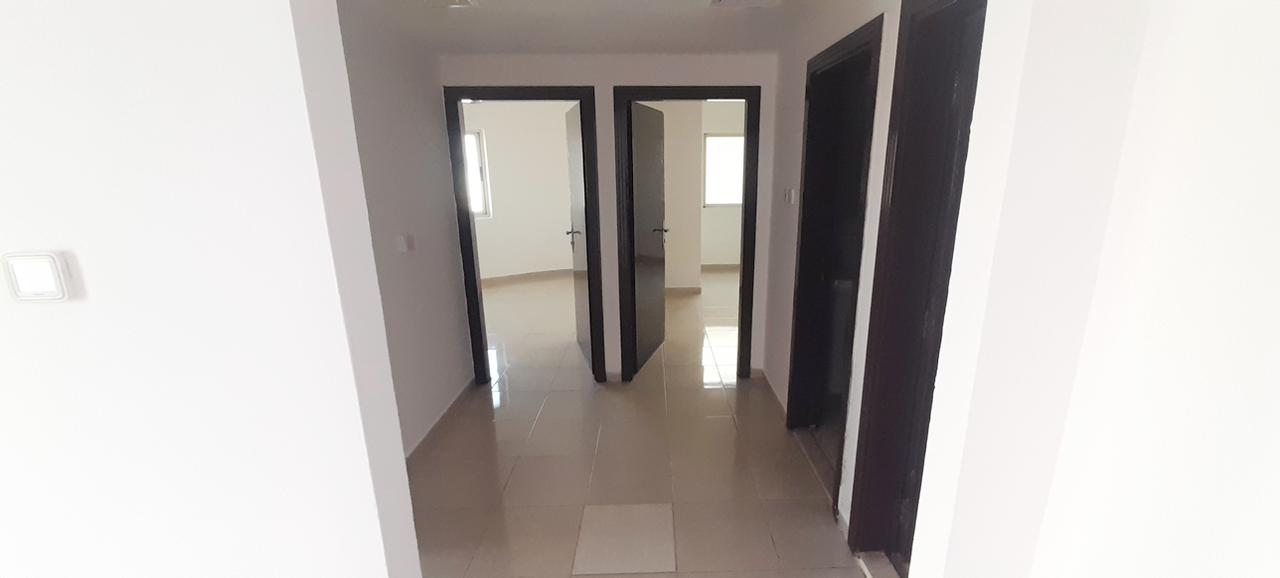 Two-bedroom with balcony, central AC, Al Qasimia. Rent AED 38,000, 4/6 payments, 5% security cheque refundable after 3 months.
