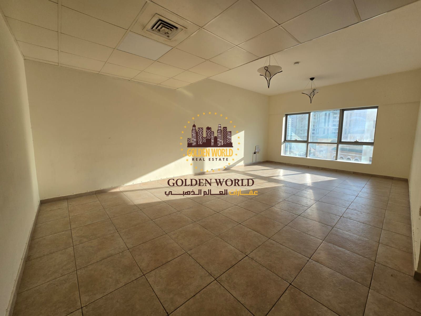Two-bedroom apartment with living area in Al Majaz 2, free air conditioning, practical layout and comfortable family living