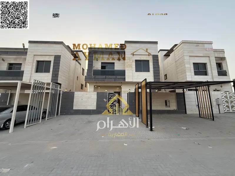 Luxury villa in Al Yasmin with six master bedrooms, a rooftop terrace, and high-end finishing, including electricity, water, and air conditioning.
