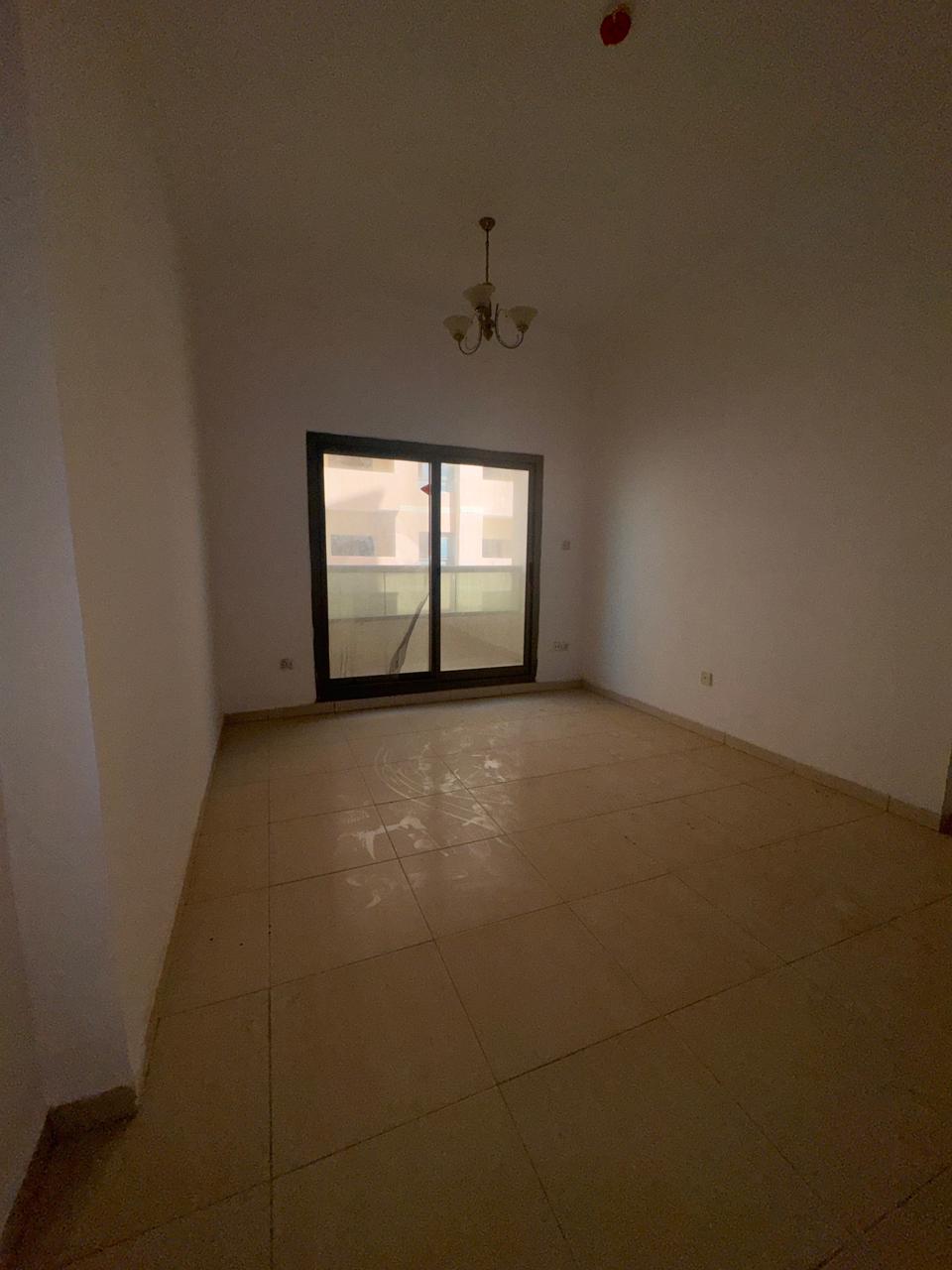The most beautiful one-bedroom apartments with a living room, balcony, two bathrooms, and a master bedroom in Ajman, UAE.