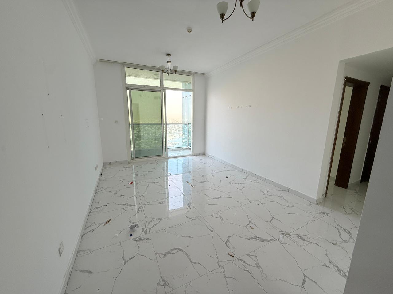 Two master bedrooms and a living room - Al Waha Towers Ajman - Family accommodation - Central air conditioning - Parking, gym and swimming pool - Free