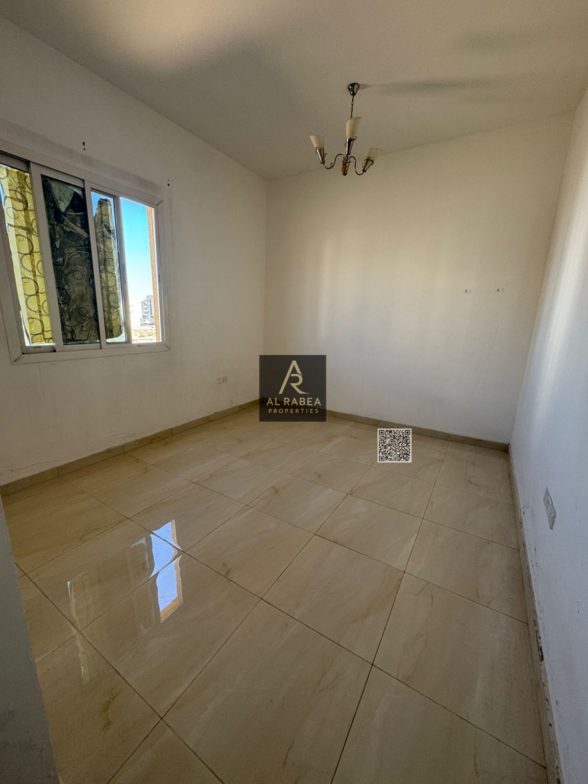 For annual rent in Ajman, Al Alia area, near Mohammed Bin Zayed exit: two bedrooms, a living room, two bathrooms, and a balcony. Rent is AED 40,000, p